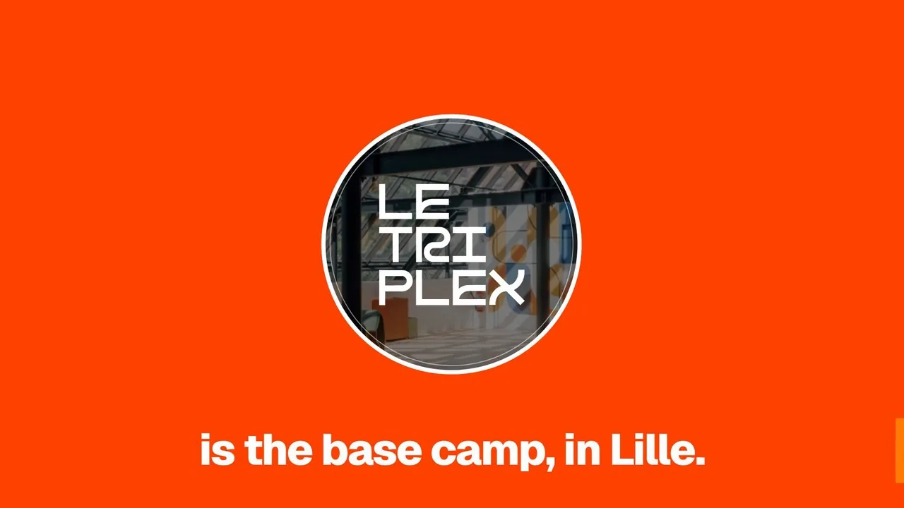 Écran orange du film de lancement d'ELEVATION : une loupe circulaire révèle l'intérieur du Triplex et son logo, au-dessus de la phrase « is the base camp, in Lille. »